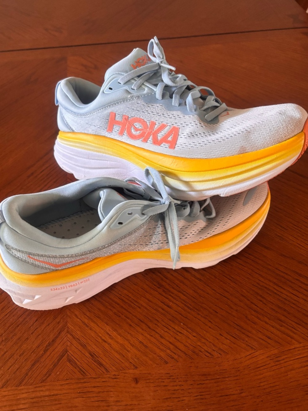 Hoka Light Blue Running Shoes with Yellow Gradient Midsole